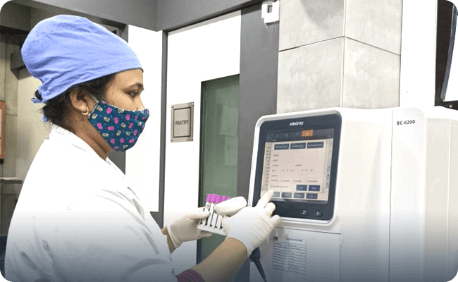 Doctor using a Machine - Clinico Diagnostic Centre & Pathology Lab