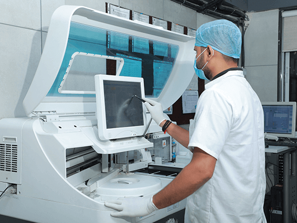 Doctor using a Machine - Clinico Diagnostic Centre & Pathology Lab