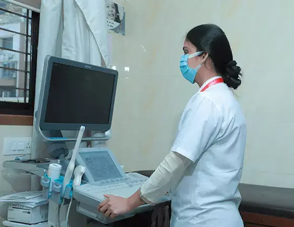 Doctor using Sonography Machine - Clinico Diagnostic Centre